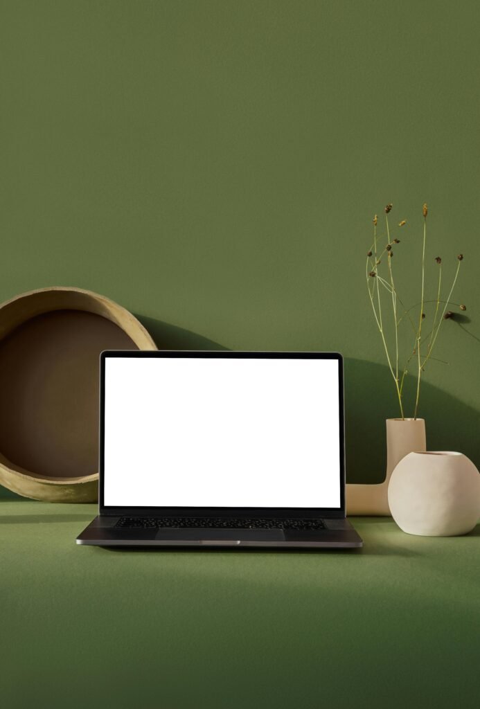 Laptop with blank screen placed on table